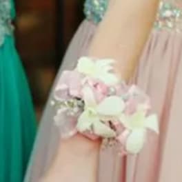 Pastel floral wrist corsage with white and pink flowers