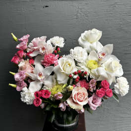 Pink and white mixed bouquet in a glass vase