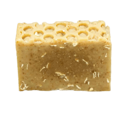 A rectangular beige soap bar with a textured top