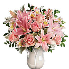 Pink lilies and roses arranged in a white vase