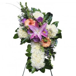Standing floral spray with pink lily, white blooms, and purple flowers