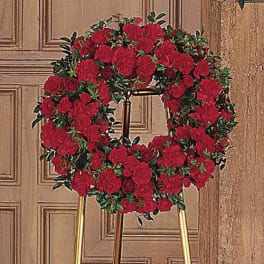 Red rose wreath on a stand