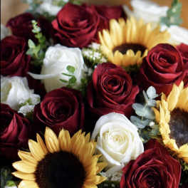 Bouquet of red and white roses with sunflowers
