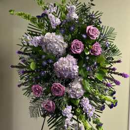 Tall standing floral spray with pink roses and lavender blooms