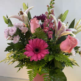 Pink and white mixed bouquet in a pink vase