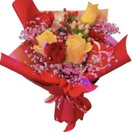 Bouquet of red and yellow roses with pink filler flowers