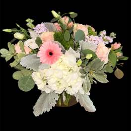 Mixed pastel bouquet with roses, hydrangea, and a pink gerbera daisy