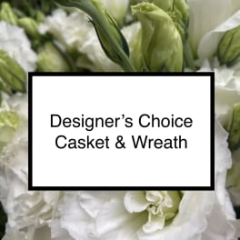 White and green floral arrangement with a text label reading Designer’s Choice Casket & Wreath