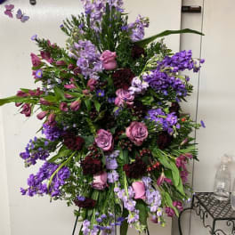 Tall purple and pink floral spray on a stand