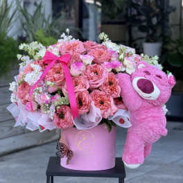 Pink rose bouquet in a pink hat box with a plush teddy bear