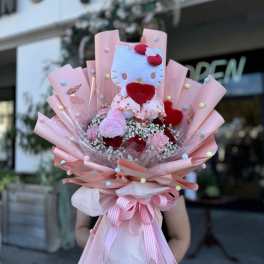 Pink bouquet with a Hello Kitty plush toy and roses