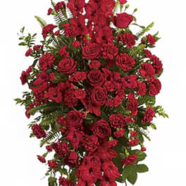 Tall red floral standing spray with roses and carnations