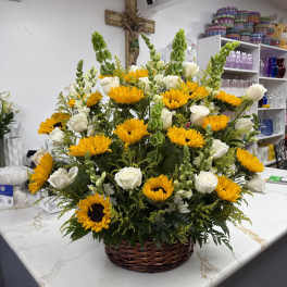 Basket arrangement of yellow sunflowers and white roses