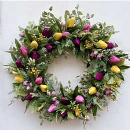 Circular wreath with pink and yellow tulips and mixed greenery