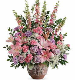 Pink and lavender floral arrangement in a decorative vase