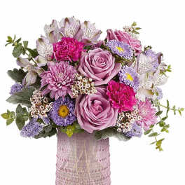 Pink and lavender bouquet in a textured pink vase