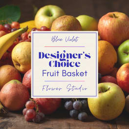 Designer’s choice fruit basket with apples, grapes, bananas, and pears