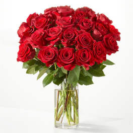Bouquet of red roses in a clear glass vase