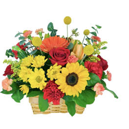 Basket arrangement of red, yellow, and orange flowers