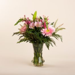 Pink mixed bouquet in a clear glass vase