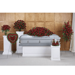 Red rose funeral casket spray with matching standing arrangements