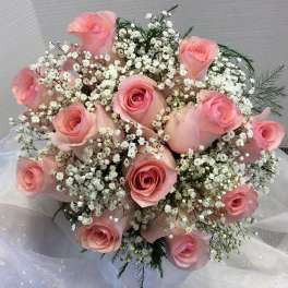 Bouquet of pink roses and white baby's breath
