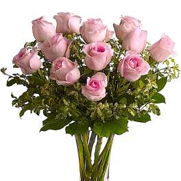 Bouquet of pale pink roses in a clear glass vase