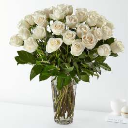 Bouquet of white roses in a clear glass vase