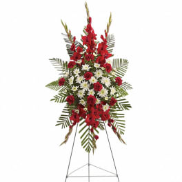 Tall red and white standing spray with carnations and mums on a metal easel