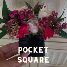Small pocket square arrangement with pink and white flowers