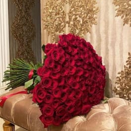 Large bouquet of red roses with long stems tied together