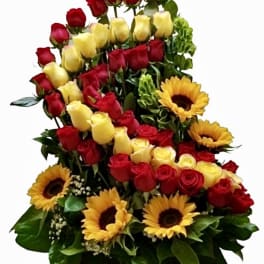 Tiered bouquet of red and yellow roses with sunflowers