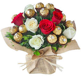 Bouquet of red and white roses with gold-wrapped chocolates in burlap