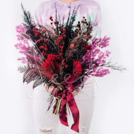 Large bouquet of red and pink flowers with a satin ribbon