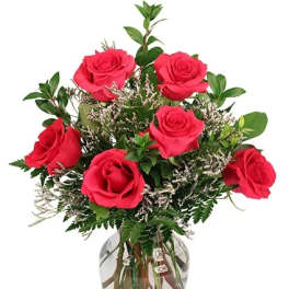 Bouquet of red roses in a clear glass vase