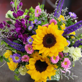 Bouquet with sunflowers, purple spikes, and pink and lavender daisies