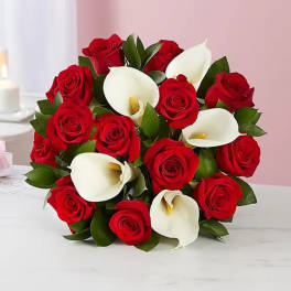 Bouquet of red roses and white calla lilies