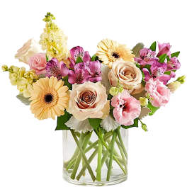 Mixed pastel bouquet in a clear glass vase