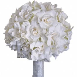 Round hand-tied bouquet of white roses with stems wrapped in white satin ribbon