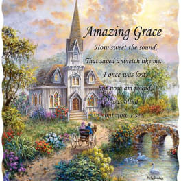 Decorative pillow with a church scene and the words "Amazing Grace"