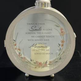 Round memorial lantern with a printed sympathy message and floral accents