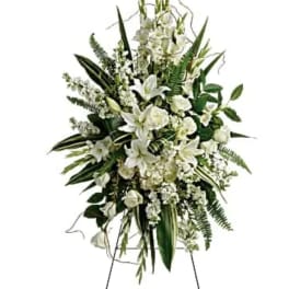 Tall white floral standing spray on an easel
