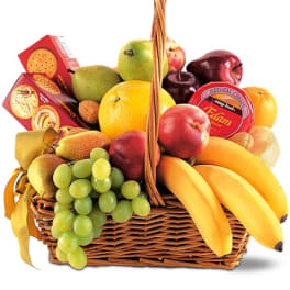 Fruit basket with bananas, grapes, pears, apples, oranges, and crackers