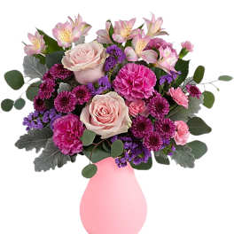 Pink and purple mixed bouquet in a pink vase