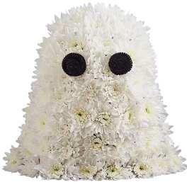 White chrysanthemum arrangement shaped like a ghost with black eyes