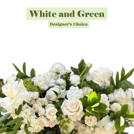 White and green floral arrangement with roses and hydrangea