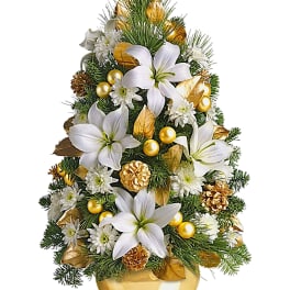 White lilies and gold ornaments arranged in a gold vase