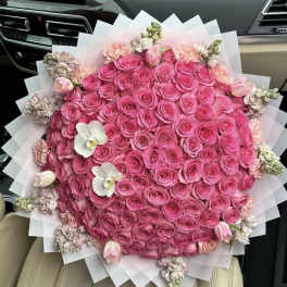 Large bouquet of pink roses with white orchids and tulips