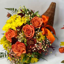 Orange roses and yellow daisies in a wicker cone with ribbon