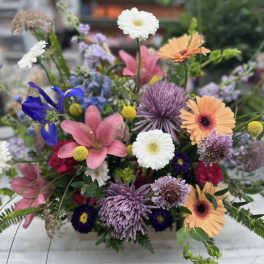 Colorful mixed bouquet with gerbera daisies, lilies, and chrysanthemums